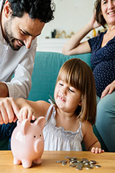 Family with Piggy Bank